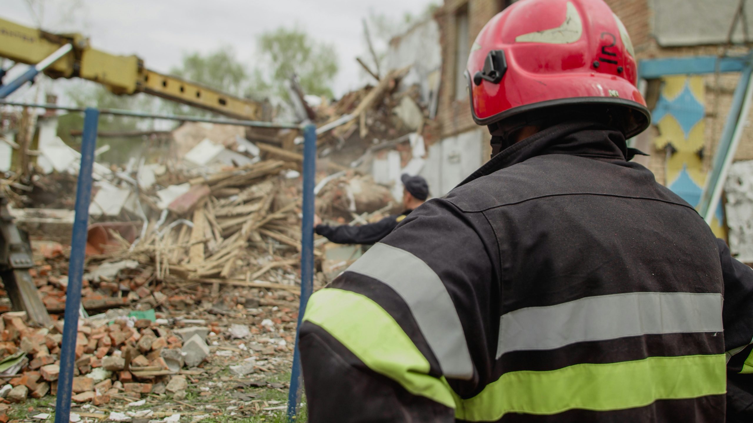 a firefighter looking at a fire
