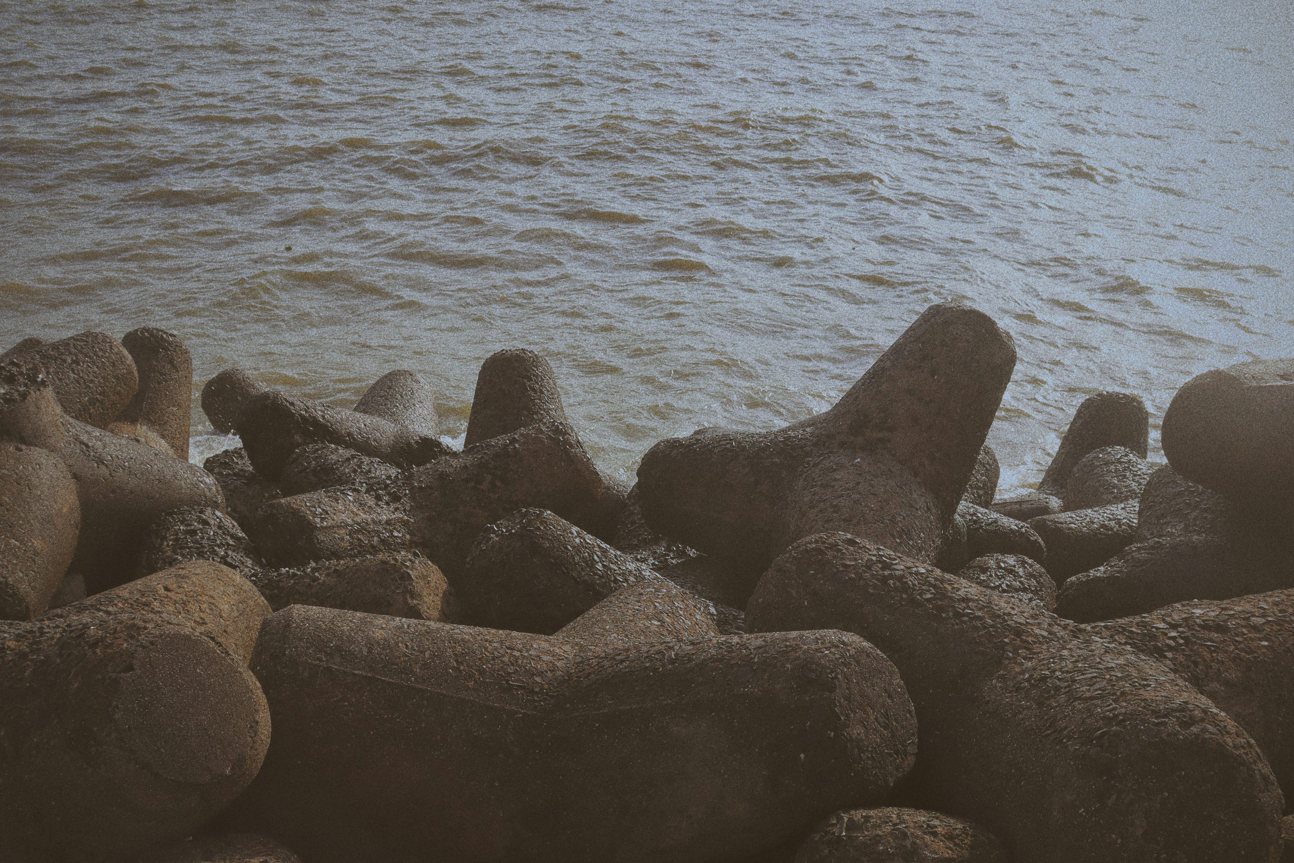 a group of rocks on a beach